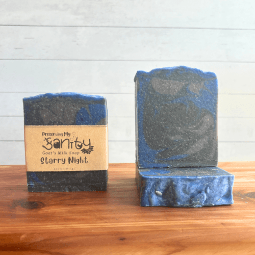 Front view photo showcasing three bars of Starry Night goat milk soap