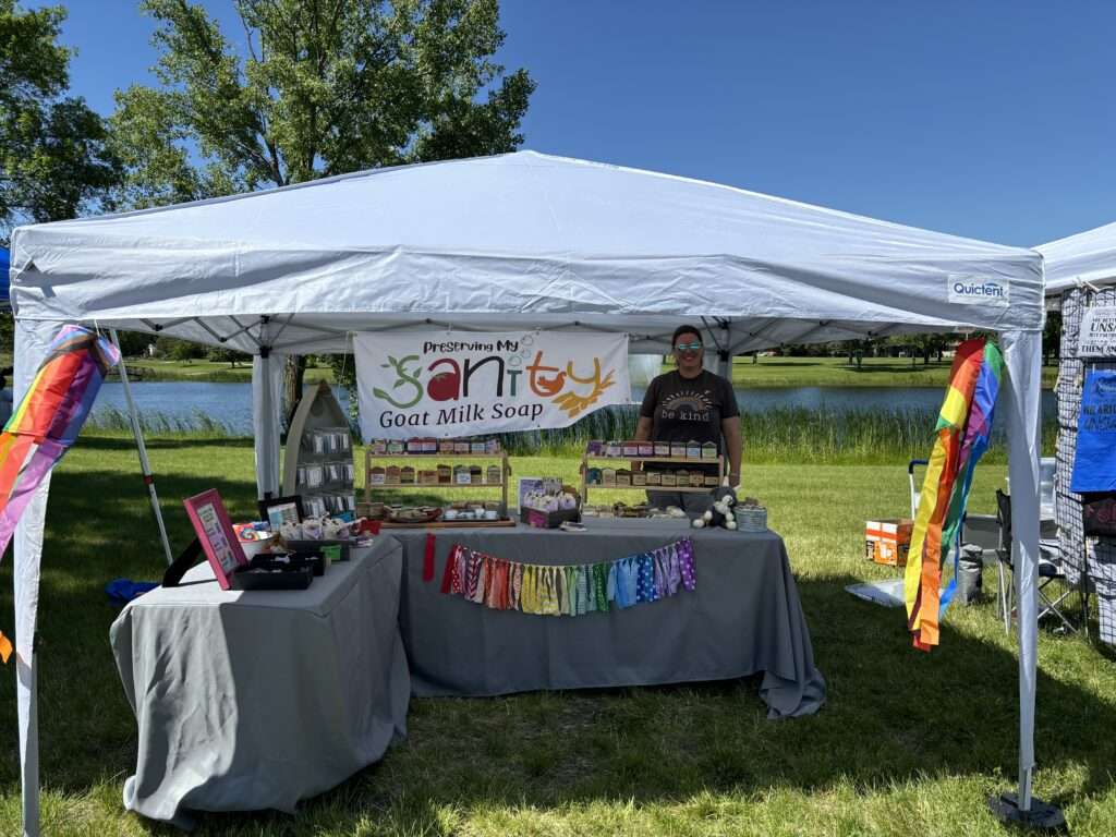 Photo of Preserving My Sanity booth in the park for a Pride Festival