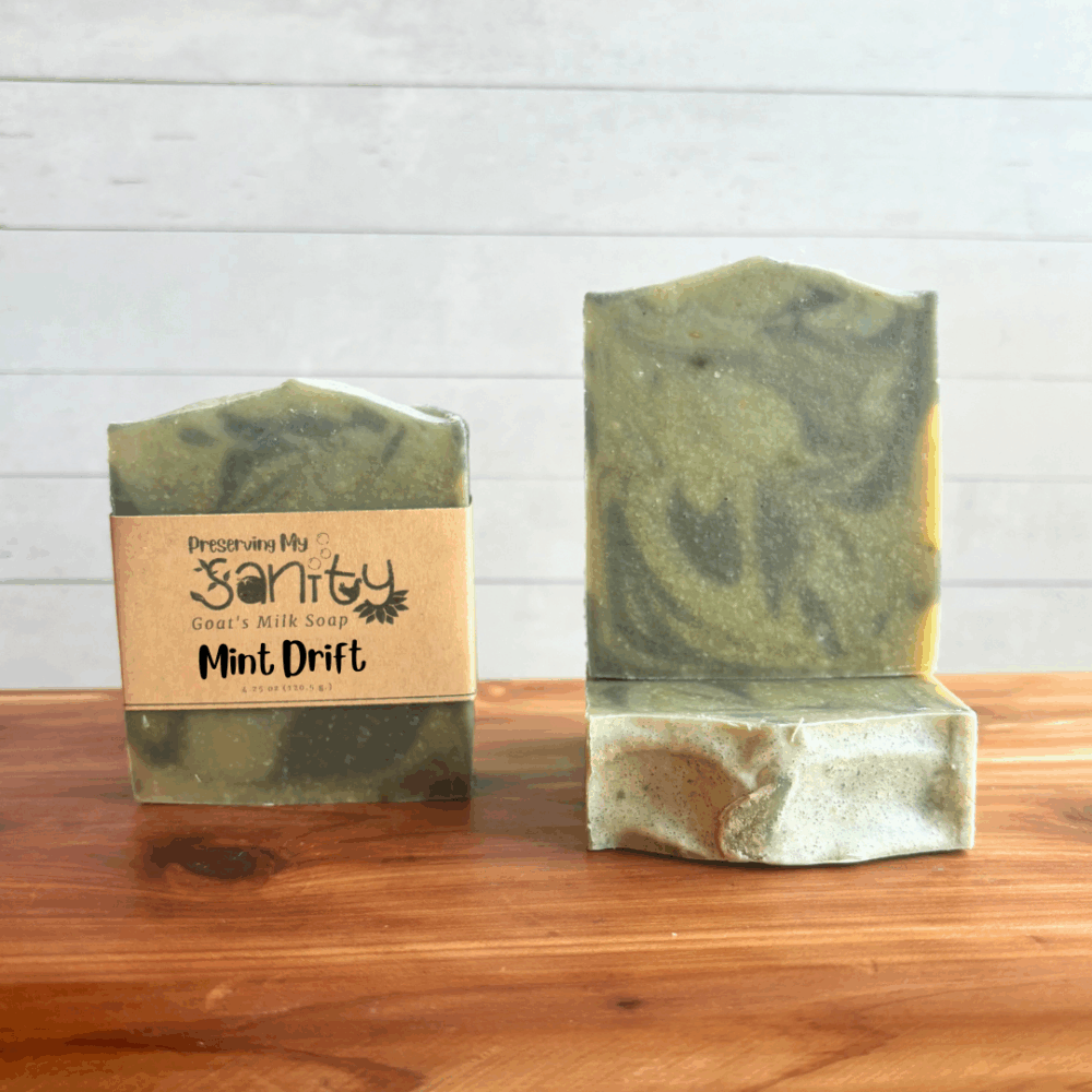 Three bars of Mint Drift goat milk soap, made with essential oils, natural colorants, and locally sourced Minnesota goat milk. The soap design is light green and dark green swirl.